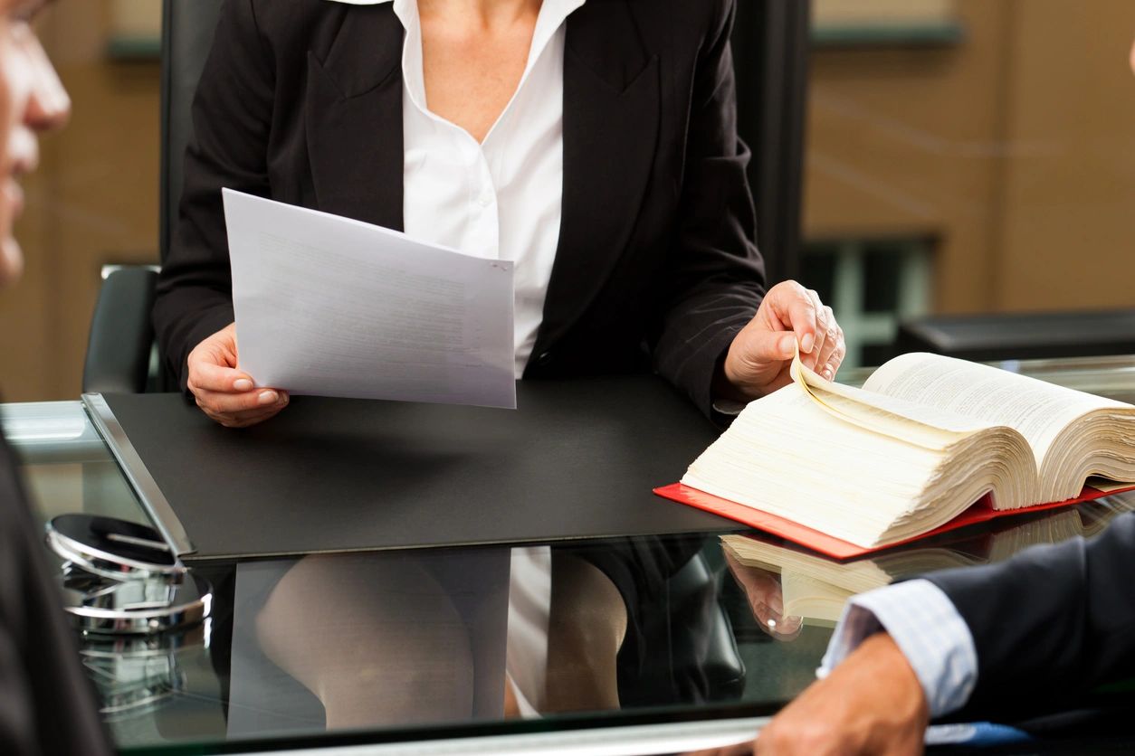 woman with book and documents